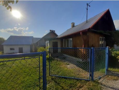 Nieruchomość gruntowa zabudowana drewnianym domem jednorodzinnym, Nielepkowice